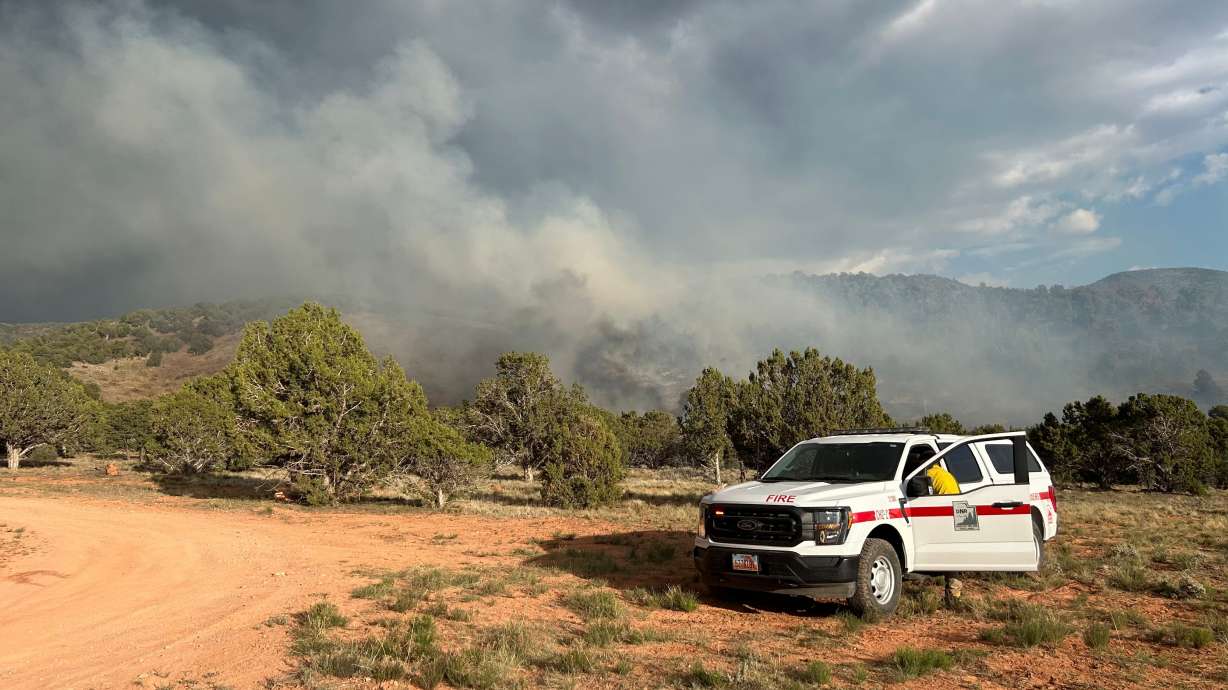 The evacuation of 50 people due to a human-caused fire was underway Sunday night near Summit in Iron County.