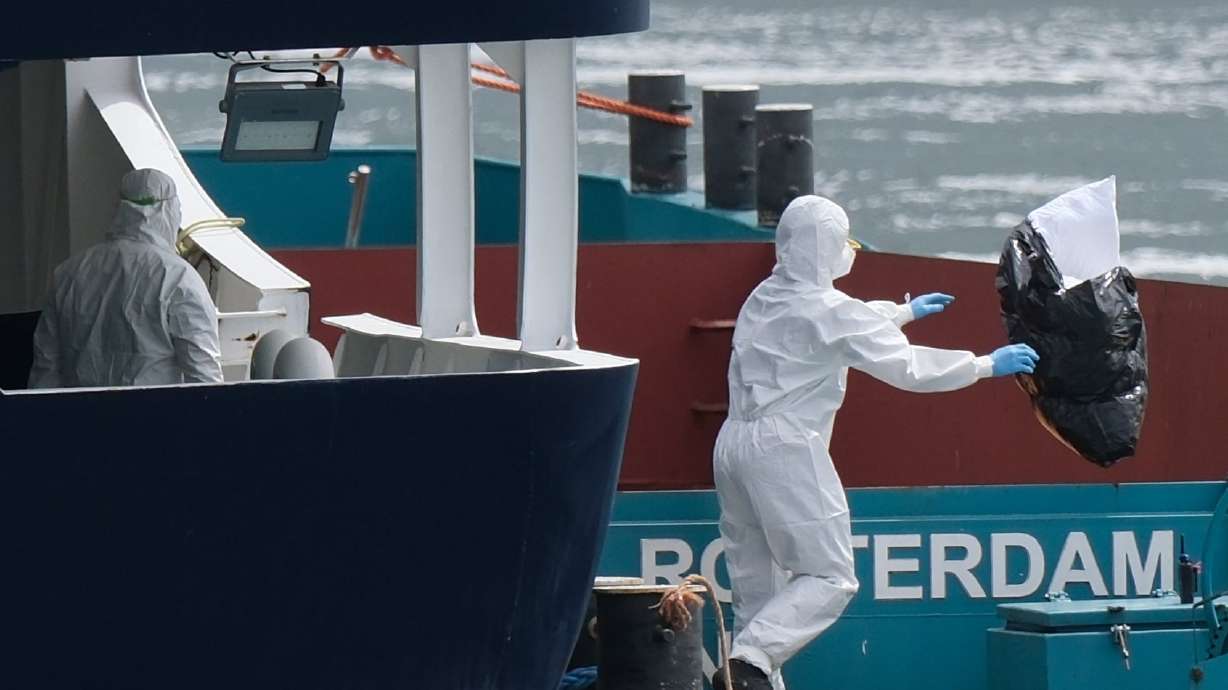 People in protective gear remove waste from the MV Hondius cruise ship after its arrival at the Port of Rotterdam, Netherlands, May 18. A new Deseret News poll shows that the hantavirus outbreak has raised concerns among Utahns.