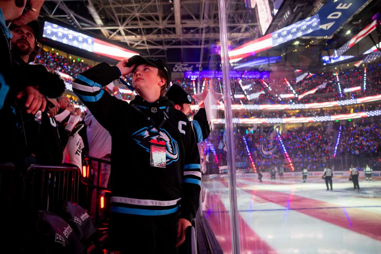 Utah Mammoth fan Quaide Garcia, 13, stands for the National Anthem before Game 6 of a first-round NHL Stanley Cup playoff series against the Vegas Golden Knights at the Delta Center in Salt Lake City on May 2.