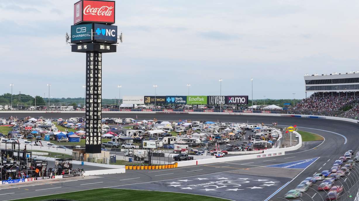 A pack of cars compete down the front stretch during a NASCAR Cup Series auto race, Sunday, May 24, 2026, in Charlotte, N.C.