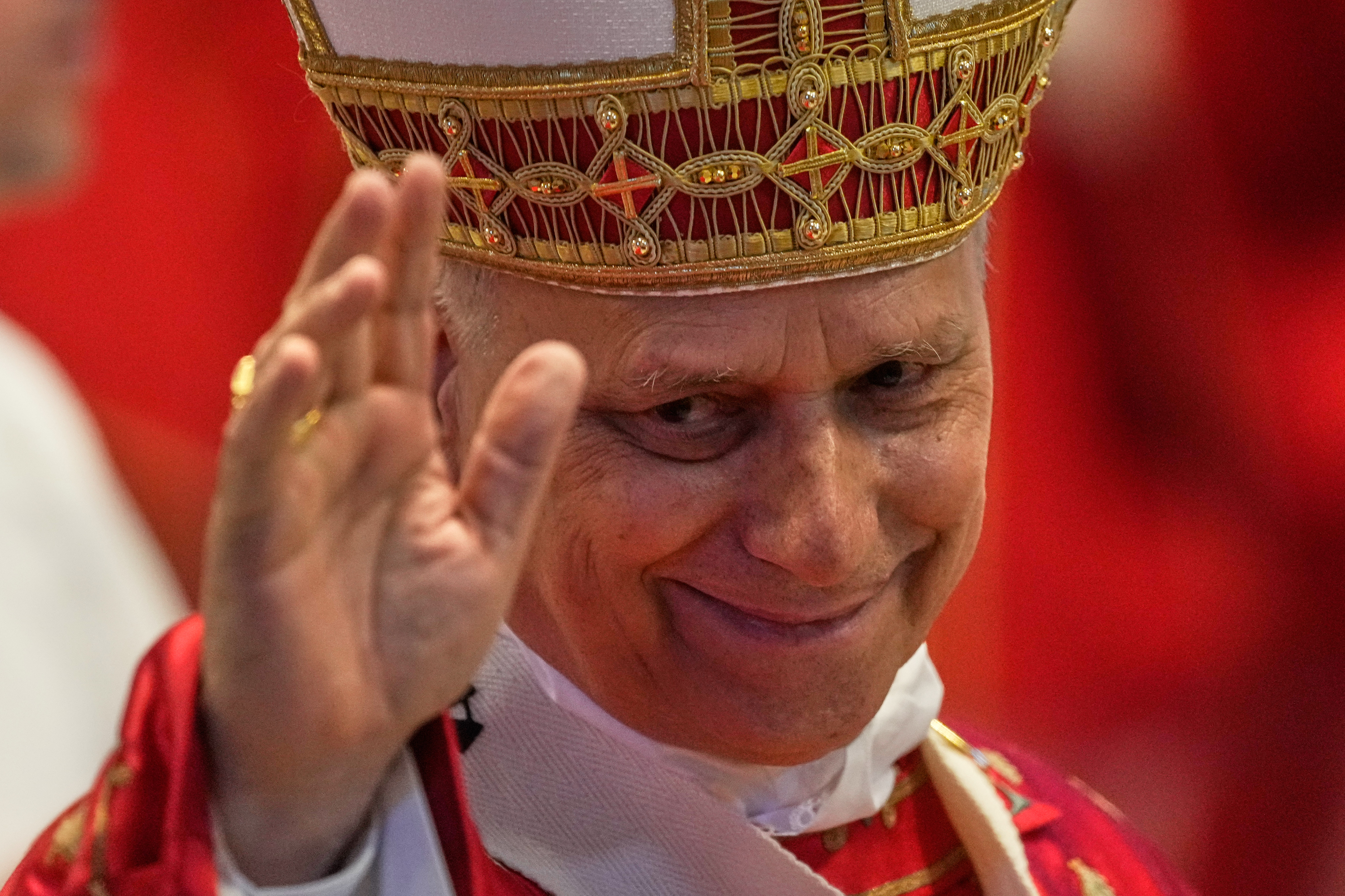 Pope Leo XIV waves to faithful at the end of the Pentecost Mass in St. Peter's Basilica, at the Vatican, on Sunday.