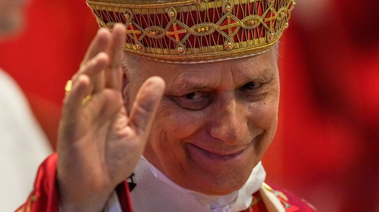 Pope Leo XIV waves to faithful at the end of the Pentecost Mass in St. Peter's Basilica, at the Vatican, on Sunday.