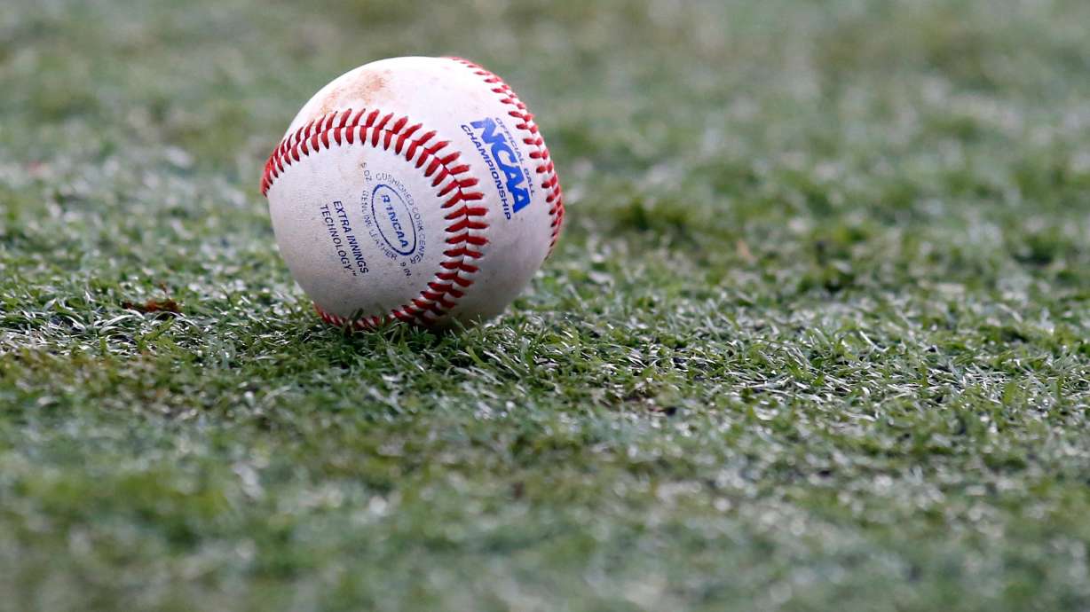 FILE - The NCAA logo is seen on a baseball during an NCAA college baseball tournament regional game between Louisiana-Lafayette and Mississippi State in Lafayette, La., June 2, 2014.