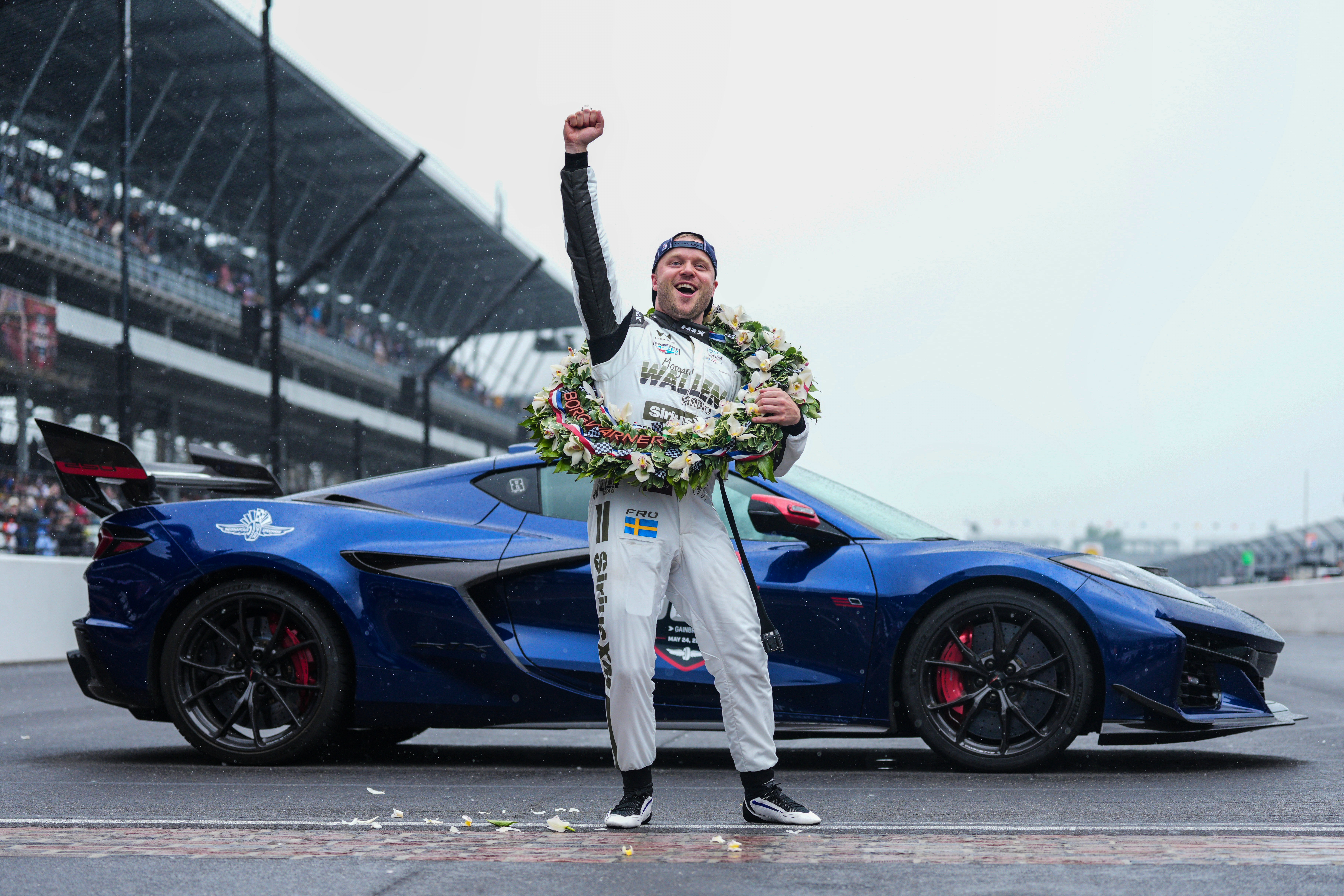 Felix Rosenqvist, of Sweden, pumps his fist at the request of track officials after winning the Indianapolis 500 auto race at Indianapolis Motor Speedway, Sunday, May 24, 2026 in Indianapolis. 