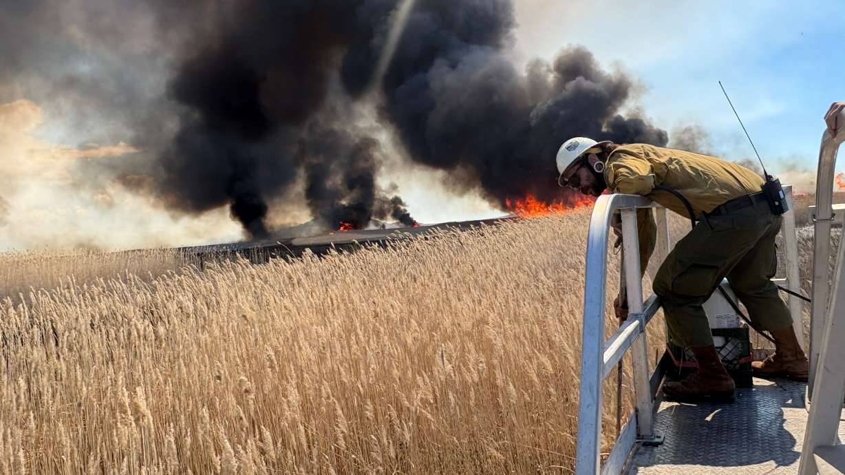 Farmington Bay controlled burn produces visible smoke across much of Davis County on Monday.