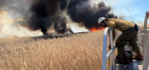 Controlled burn in Farmington Bay produces large plumes of smoke