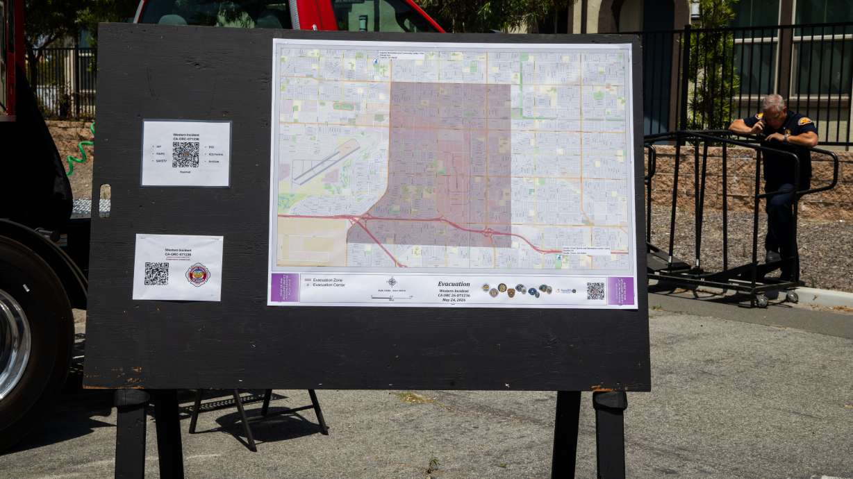 An evacuation map is displayed at the incident command post at the Los Alamitos Race Course in Cypress, Calif., on Sunday. Officials on Monday lifted evacuation orders near a damaged chemical tank for residents.
