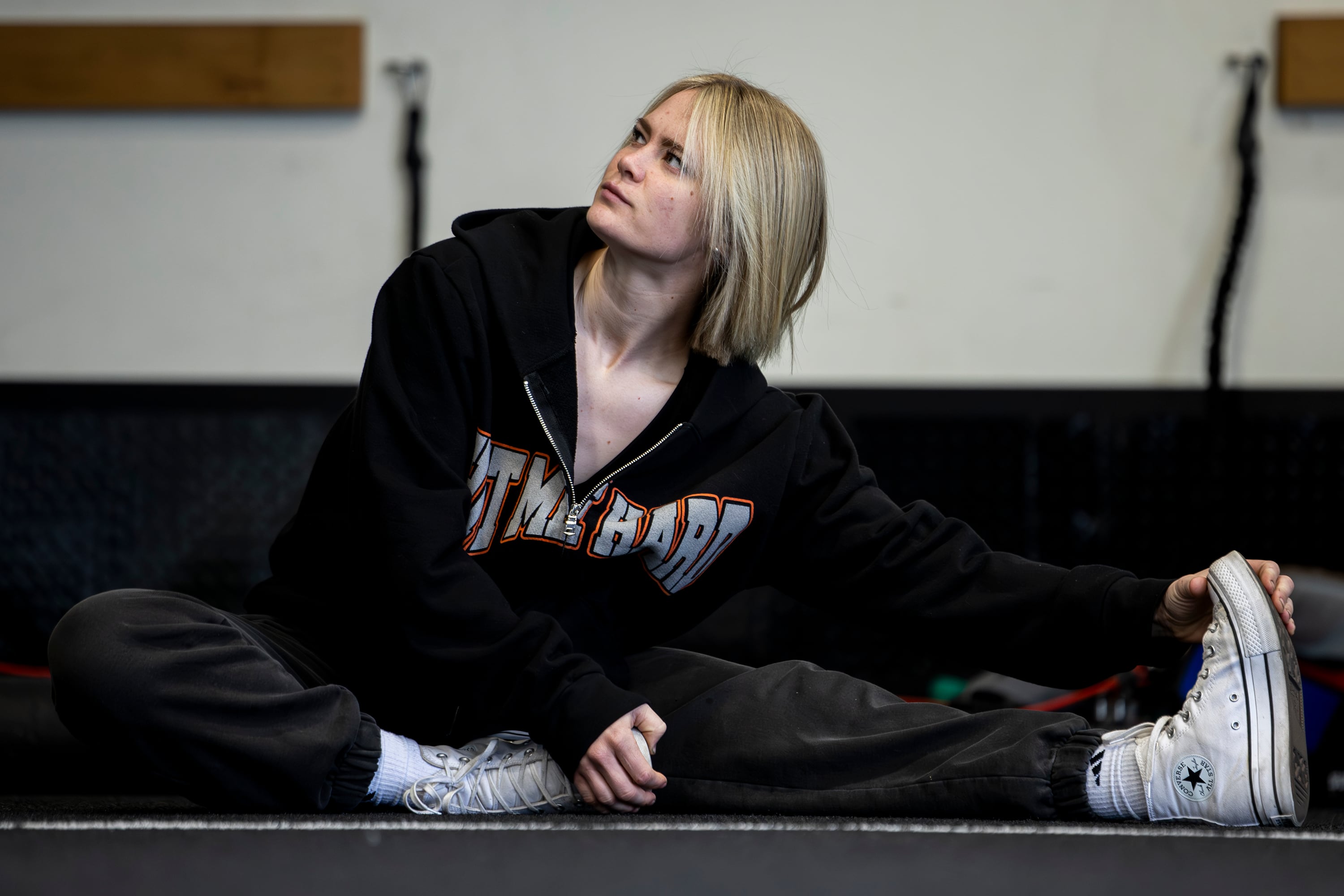 Stuntwoman Katelynn Olson stretches as she works out at P1 Athlete in Lehi on May 17. Olson recreated action sequences as a child at home in Lehi.