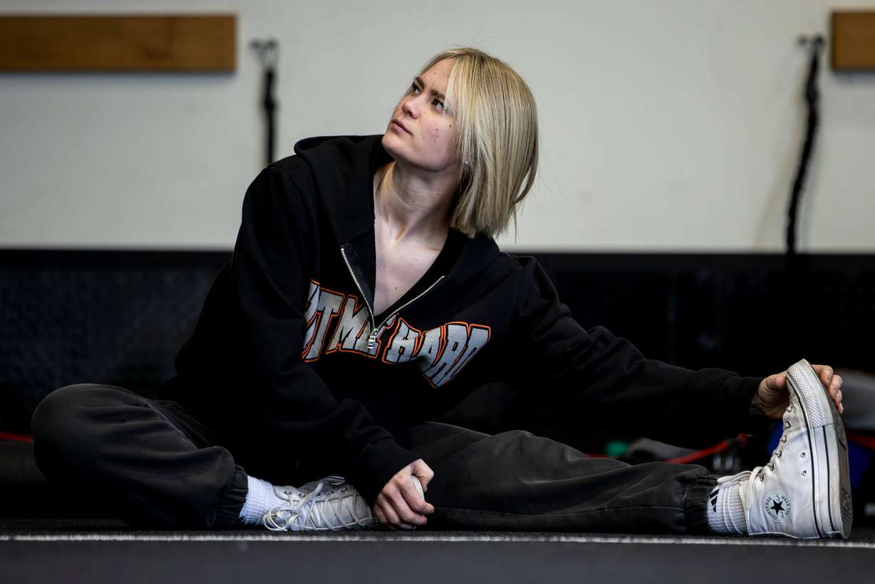 Stuntwoman Katelynn Olson stretches as she works out at P1 Athlete in Lehi on May 17. Olson recreated action sequences as a child at home in Lehi.