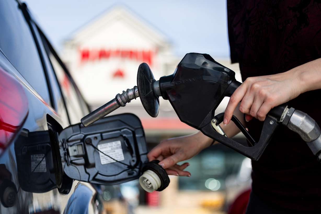 An individual fills up their car with gas at a Maverik gas station in Herriman on March 12. Gas prices are continuing to rise as the Iran war continues.