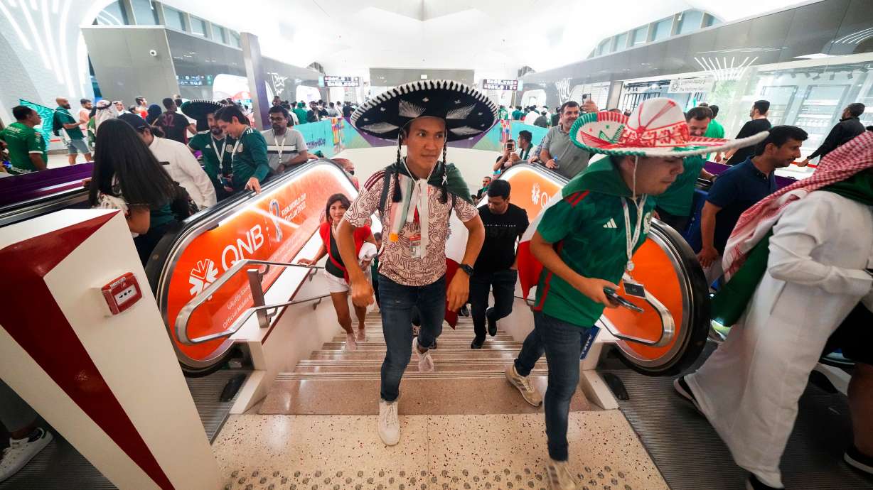 FILE - Mexico soccer fans exit the metro station on their way to a World Cup group C soccer match between Saudi Arabia and Mexico, at the Lusail Stadium in Lusail, Qatar, Wednesday, Nov. 30, 2022.