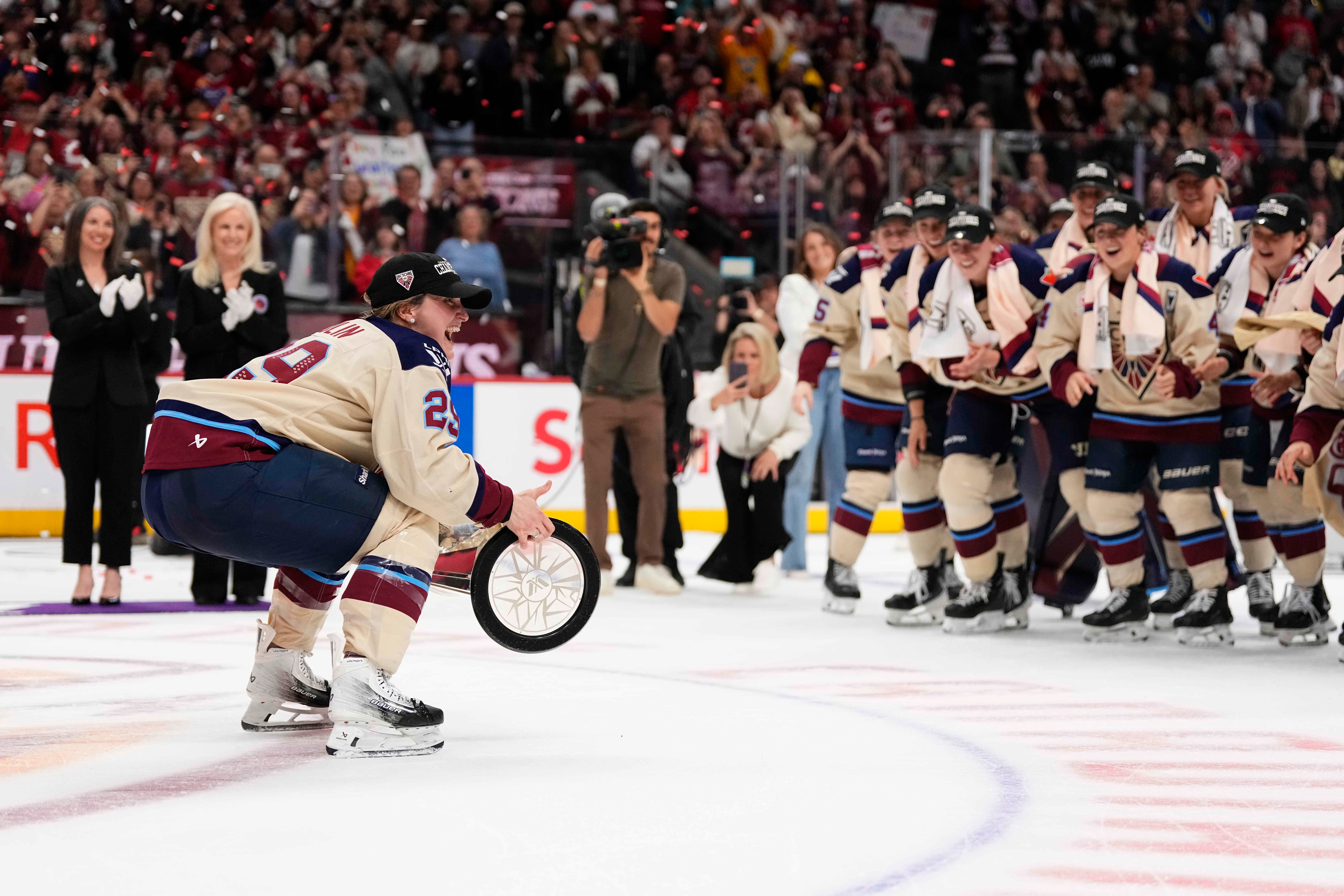 Montreal Victoire's Marie-Philip Poulin (29) carries the PWHL Walter Cup to her teammates, after the team's win against the Ottawa Charge, in Ottawa, on Wednesday, May 20, 2026. CORRECTION: name of photographer Justin Tang