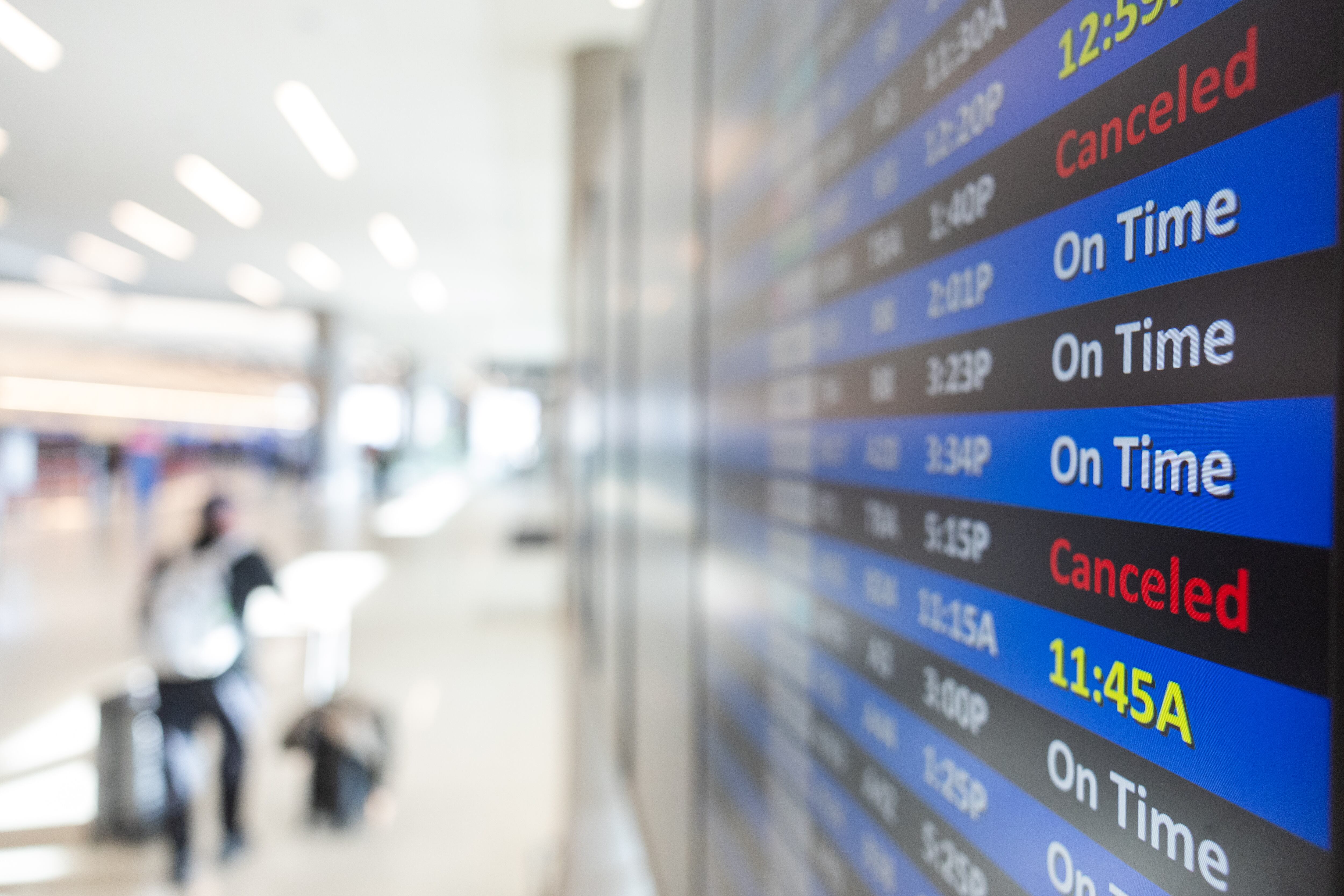 The departure and arrival boards at Salt Lake City International Airports display some of the canceled flights to the the government shutdown on Nov. 19. A bipartisan group of senators proposed a bill to keep Congress in Washington during future shutdowns, restricting them from leaving D.C.