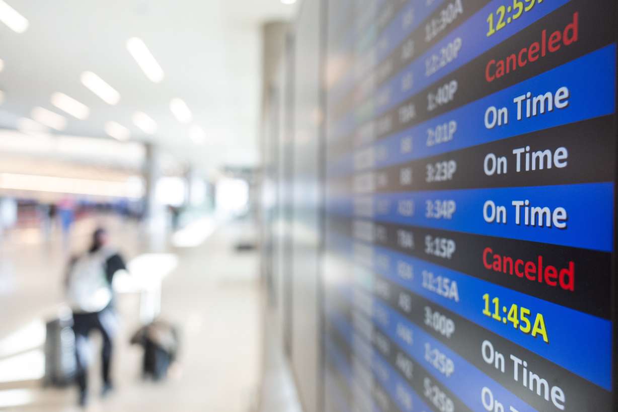 The departure and arrival boards at Salt Lake City International Airports display some of the canceled flights to the the government shutdown on Nov. 19. A bipartisan group of senators proposed a bill to keep Congress in Washington during future shutdowns, restricting them from leaving D.C.