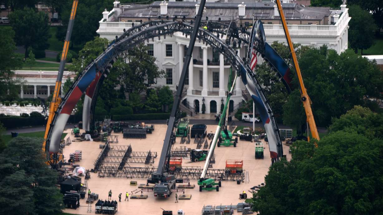 Equipment being placed on the South Lawn of the White House is seen from the Washington Monument, Tuesday, May 26, 2026, in Washington. The UFC is holding a mixed martial arts fight on June 14 as part of America 250 celebrations.