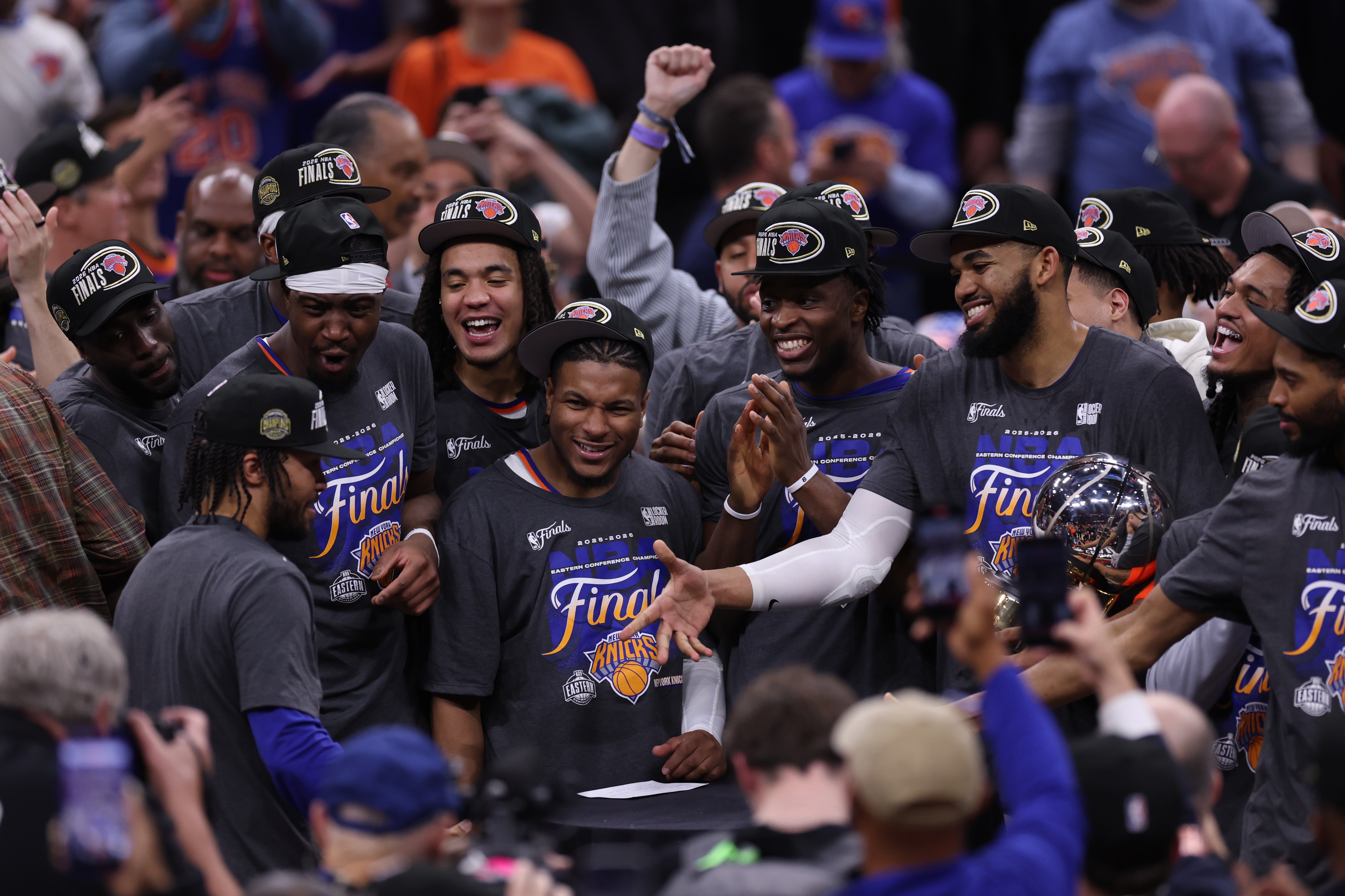 New York Knicks players celebrate with guard Jalen Brunson, left, after he was awarded with the MVP trophy after winning Game 4 in the Eastern Conference finals NBA basketball playoffs series against the Cleveland Cavaliers in Cleveland, Monday, May 25, 2026. 