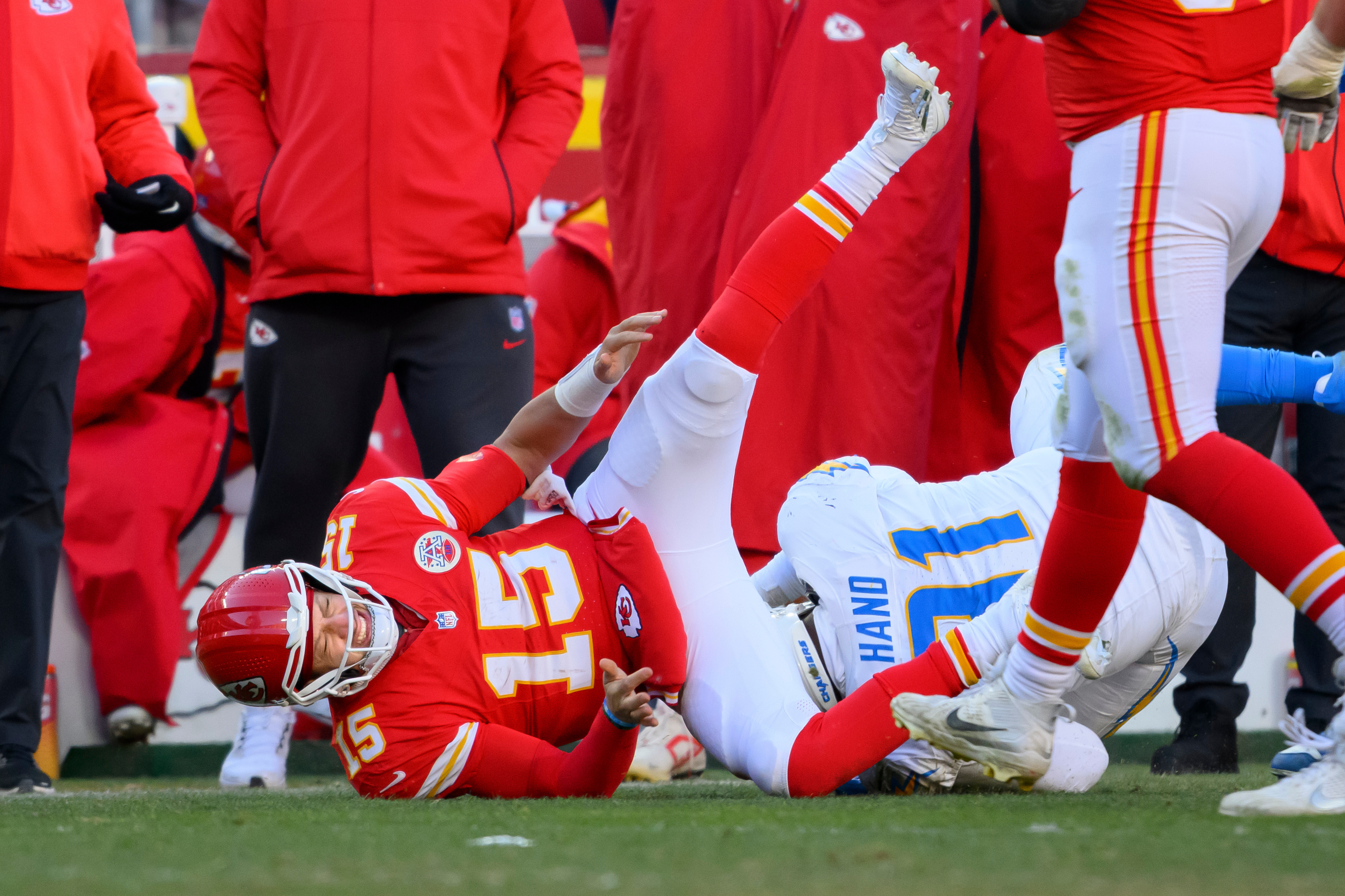FILE - Kansas City Chiefs quarterback Patrick Mahomes (15) is injured while being tackled by Los Angeles Chargers defensive tackle Da'Shawn Hand (91) during the second half of an NFL football game, Dec. 14, 2025 in Kansas City, Mo. 