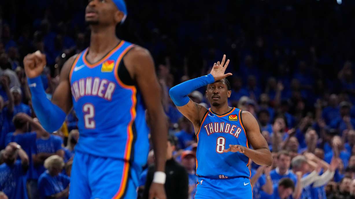 Oklahoma City Thunder guard Jalen Williams (8) and guard Shai Gilgeous-Alexander (2) celebrate after a 3-pointer during the second overtime of Game 1 in a third-round NBA basketball playoffs series against the San Antonio Spurs Monday, May 18, 2026, in Oklahoma City.