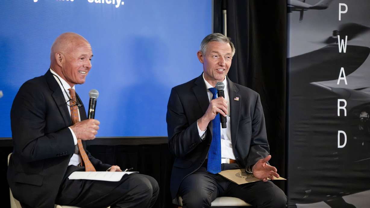 Rep. Mike Kennedy, R-Utah, talks with Carlos M. Braceras, executive director of the Utah Department of Transportation, about Utah air mobility futures as they attend the 47G Advanced Air Mobility Summit at the University of Utah on Tuesday.