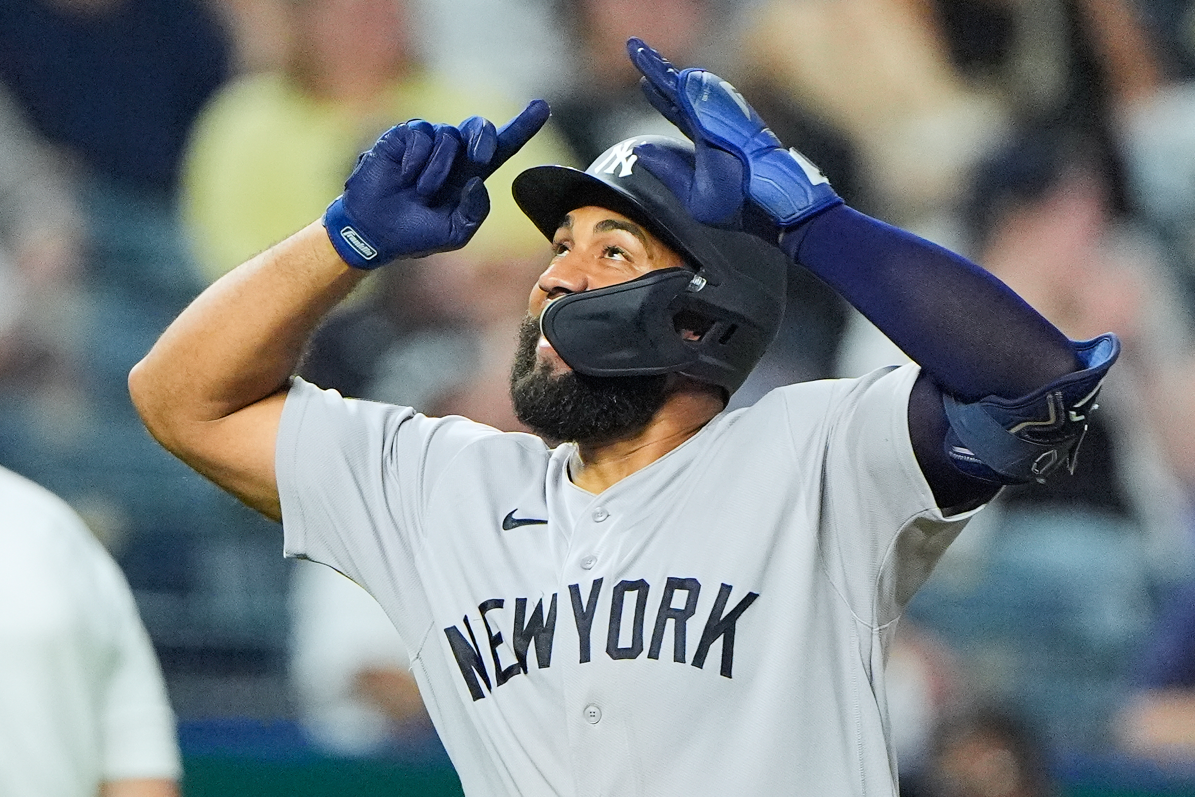 New York Yankees' Amed Rosario celebrates after hitting a two-run home run during the ninth inning of baseball game against the Kansas City Royals, Tuesday, May 26, 2026, in Kansas City, Mo. 