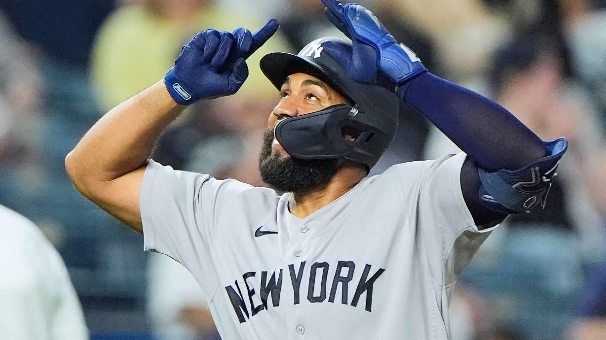 New York Yankees' Amed Rosario celebrates after hitting a two-run home run during the ninth inning of baseball game against the Kansas City Royals, Tuesday, May 26, 2026, in Kansas City, Mo.