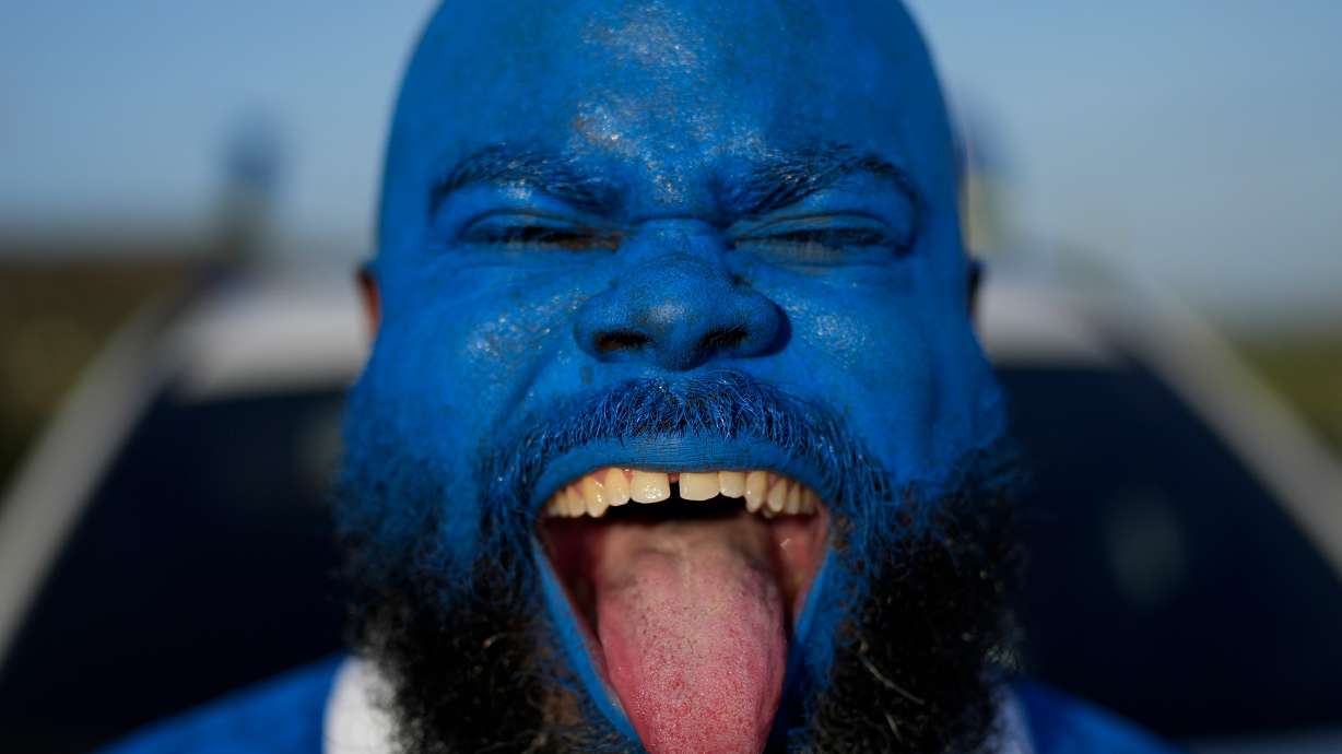 Brenton Balentien, known as Blue Face, a leader of supporters of Curacao’s national soccer team, poses wearing face paint in the team’s colors in Willemstad, Curacao, Saturday, May 16, 2026.