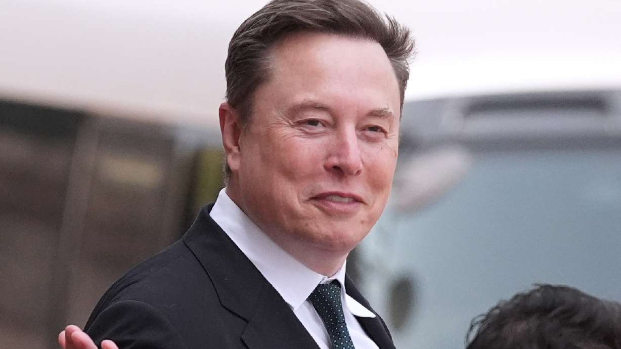 Elon Musk departs after a welcome ceremony with President Donald Trump and China's President Xi Jinping at the Great Hall of the People, May 14, in Beijing.