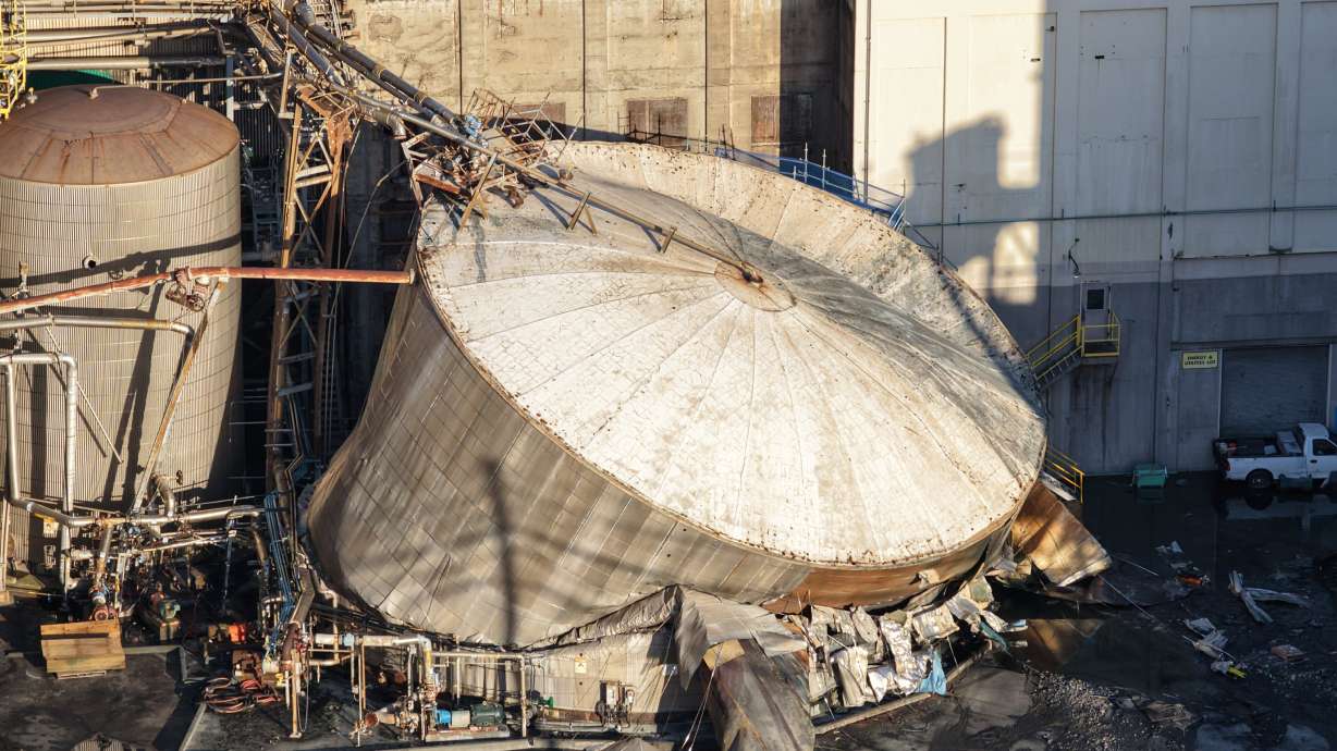 Damage is seen at Nippon Dynawave Packaging Co., after a tank containing hazardous liquid imploded, on Tuesday in Longview, Wash. Authorities said Wednesday a second person died from their injuries, bringing the presumed death toll to 11.