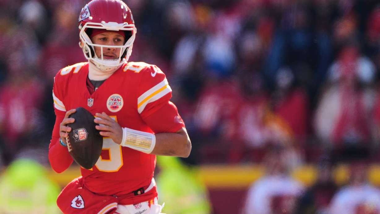 FILE - Kansas City Chiefs quarterback Patrick Mahomes looks to pass during the first half of an NFL football game against the Los Angeles Chargers, Dec. 14, 2025, in Kansas City, Mo.