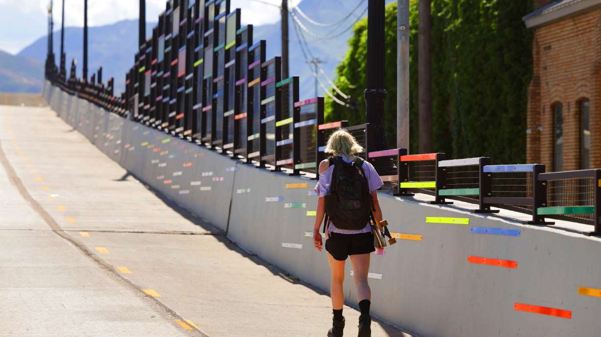 A pedestrian crosses the 400 South Viaduct Trail in Salt Lake City on Wednesday. Salt Lake City and the Utah Department of Transportation are reviewing adjustments to it after a new law calls on the city to implement project mitigations.
