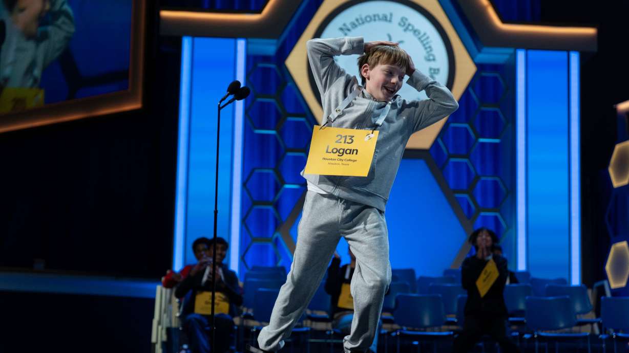 Logan Bailey, 12, of Houston, Texas, reacts after correctly spelling his word during the semifinals of the Scripps National Spelling Bee at DAR Constitution Hall, Wednesday, in Washington. A field of 247 are taking the stage this week.