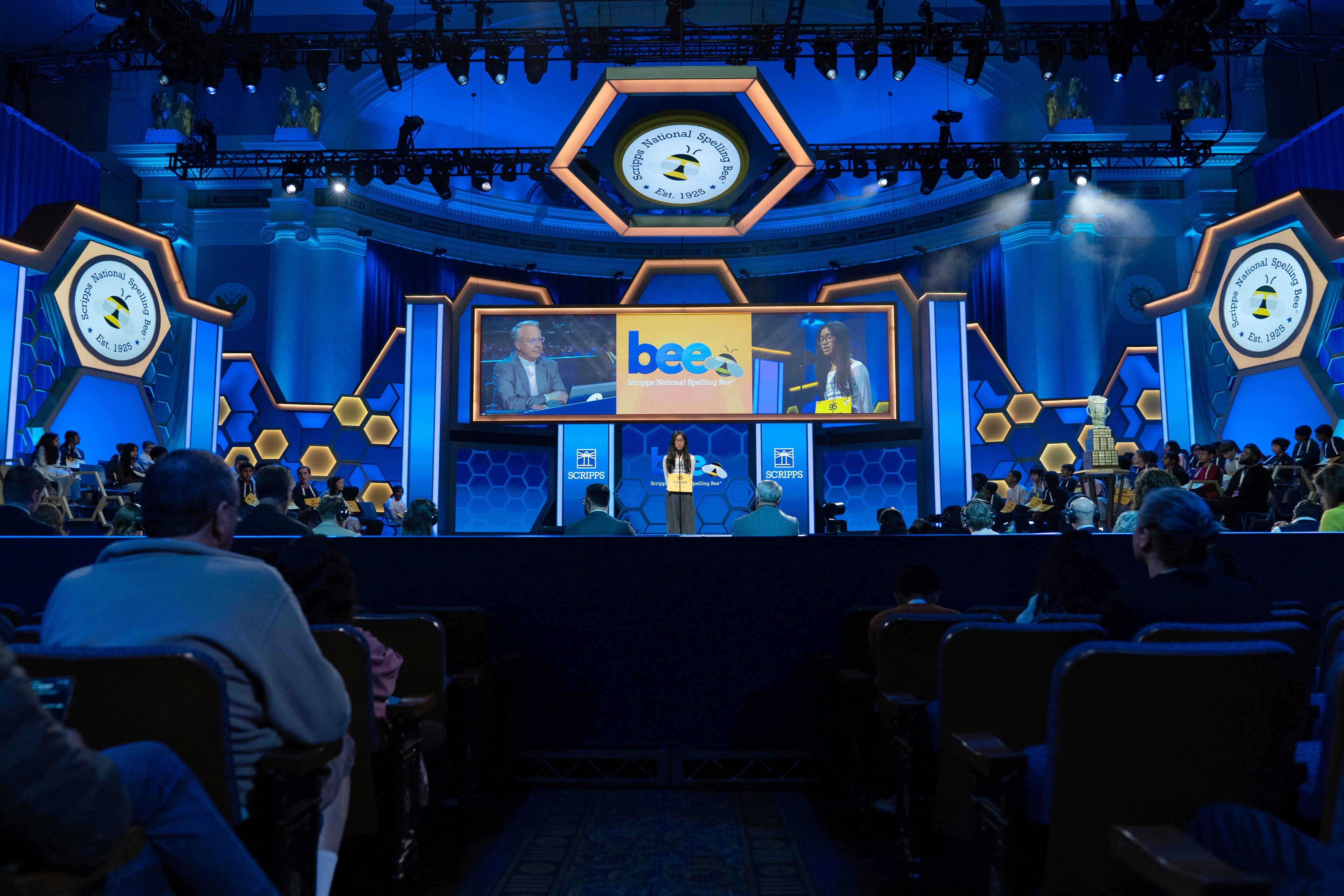 Lauren Merillana, 14, of North Potomac, Md., spells her word during the semifinals of the Scripps National Spelling Bee at DAR Constitution Hall, Wednesday, in Washington. The bee underwent significant changes to give it a "big-game feel."