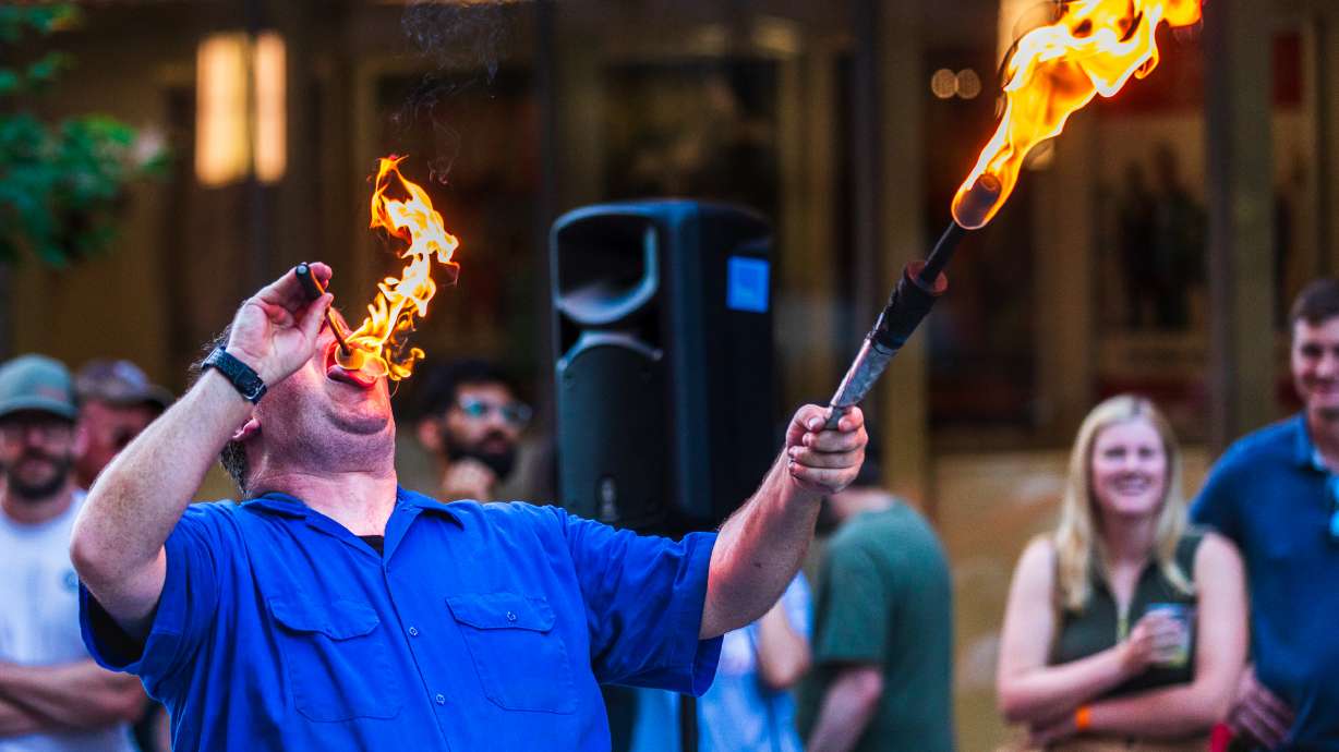 Greg Frisbee performs a fire-eating trick at Busker Fest in Salt Lake City on May 30, 2025. Busker Fest returns this Friday and Saturday, but questions now loom about its future after proposed budget cuts.