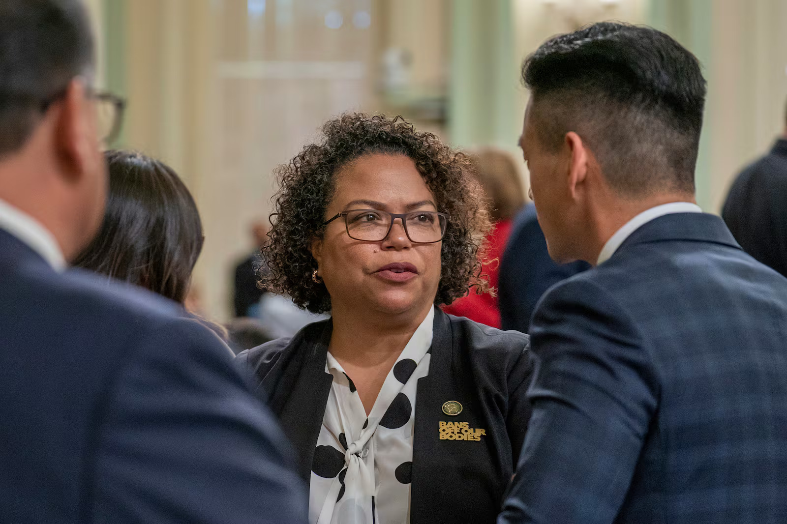 Assembly member Mia Bonta, D-Oakland, talks with Assembly member Evan Low, D-Silicon Valley, at the Capitol in Sacramento, Calif., June 1, 2023. Bonta cosponsored the "Stop Nick Shirley Act," which passed the Assembly on Tuesday.
