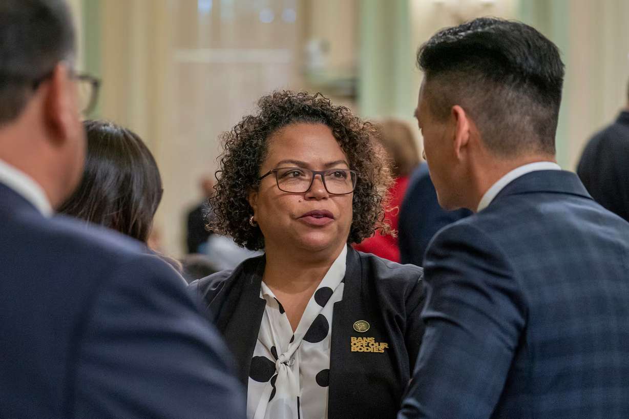Assembly member Mia Bonta, D-Oakland, talks with Assembly member Evan Low, D-Silicon Valley, at the Capitol in Sacramento, Calif., June 1, 2023. Bonta cosponsored the "Stop Nick Shirley Act," which passed the Assembly on Tuesday.