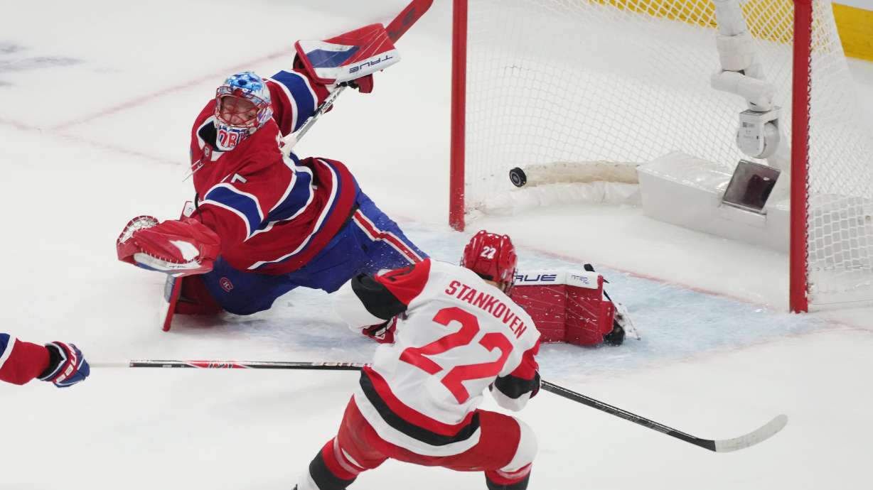 Carolina Hurricanes' Logan Stankoven (22) scores on Montreal Canadiens goaltender Jakub Dobes (75) during the first period of Game 4 of NHL Eastern Conference final Stanley Cup playoff series action in Montreal, Quebec, Wednesday, May 27, 2026.
