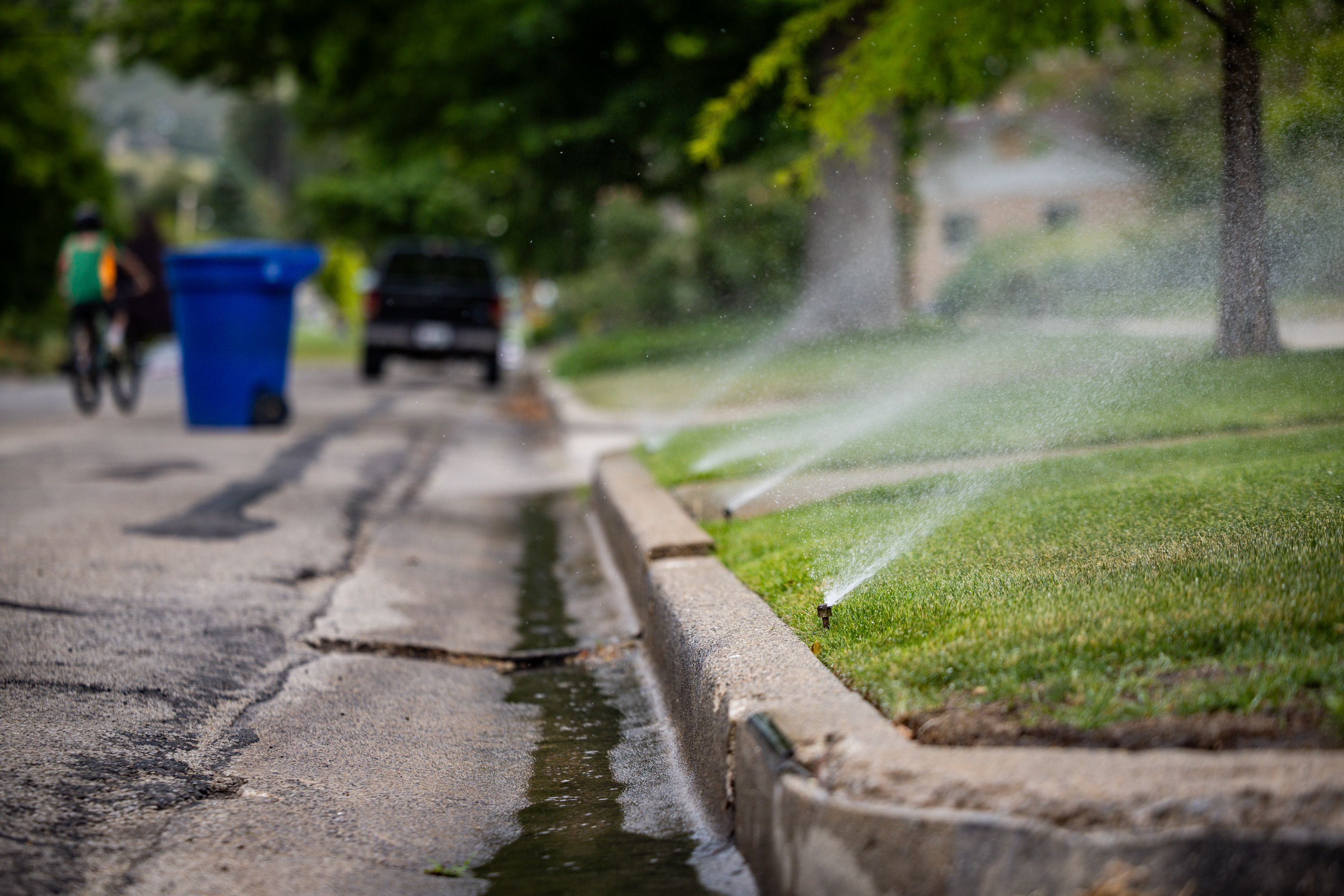 Sprinklers spray water on a lawn in the Avenues in Salt Lake City on Tuesday. Lawmakers have proposed several options for enforcing water restrictions this summer.