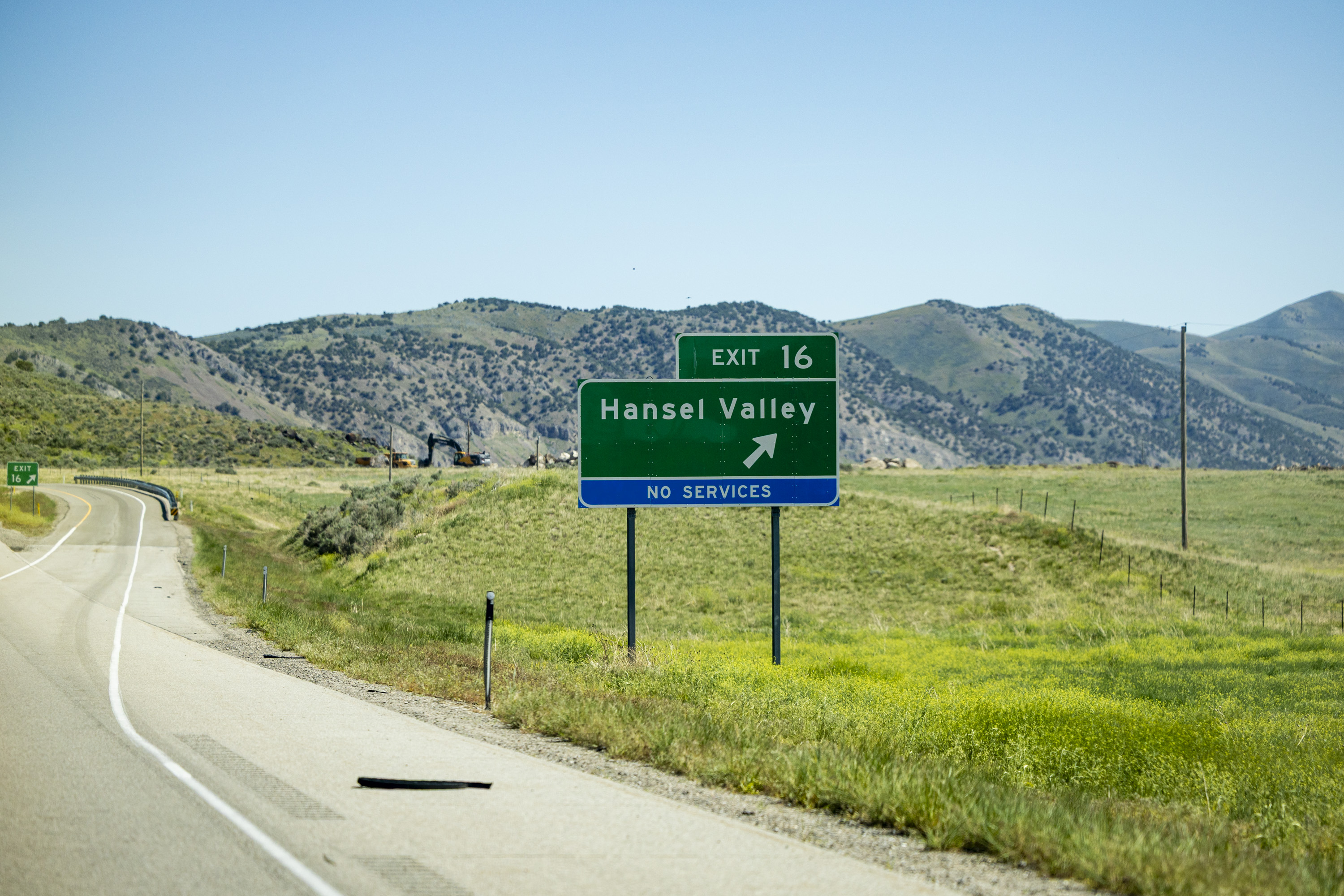 An interstate exit sign is posted near land proposed for the Stratos Project data center in the Hansel Valley area of Box Elder County on May 12. A new poll showed 53% of Utahns opposed the project because of water usage concerns.