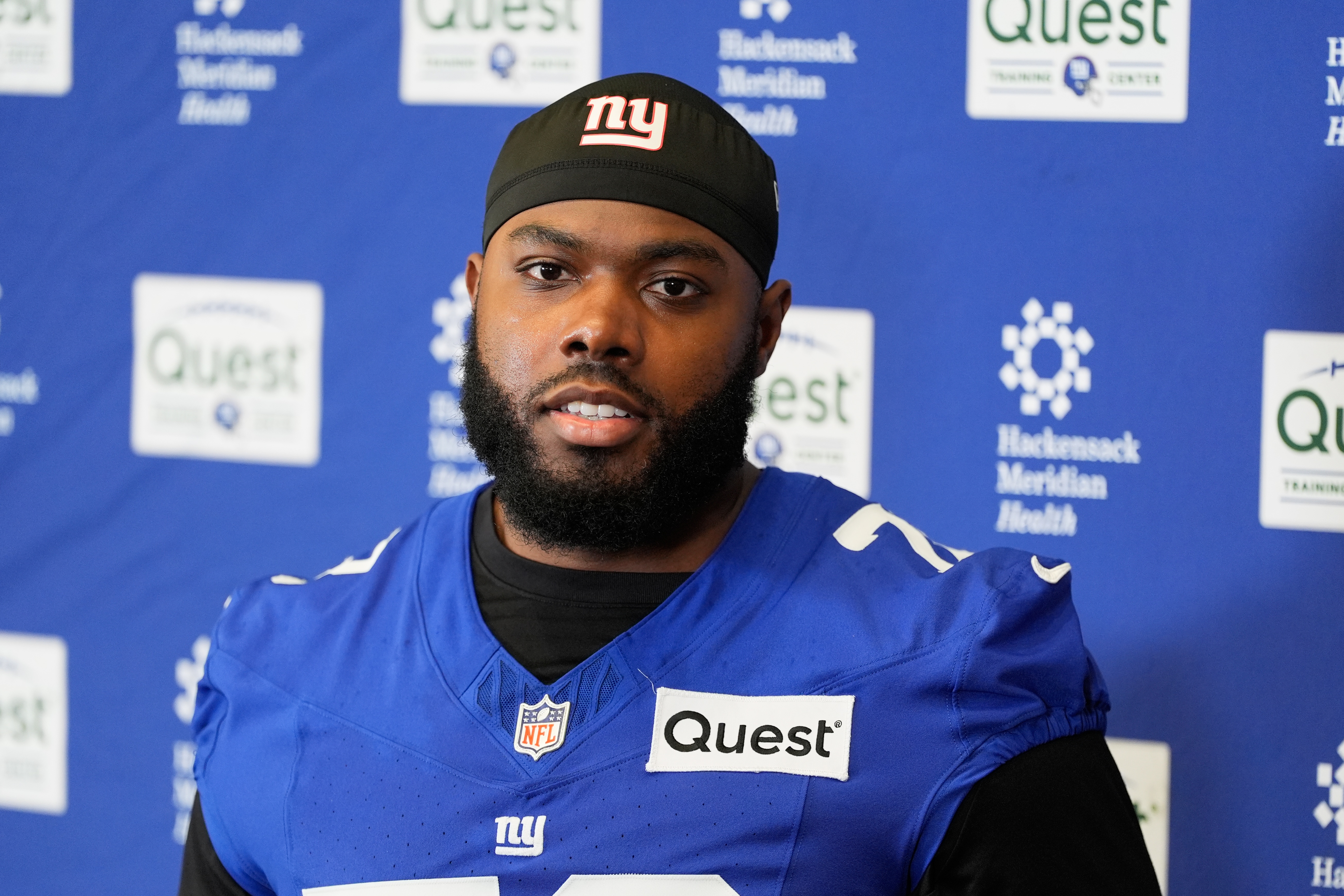 Giants restructure left tackle Andrew Thomas' contract to clear cap space, AP source says