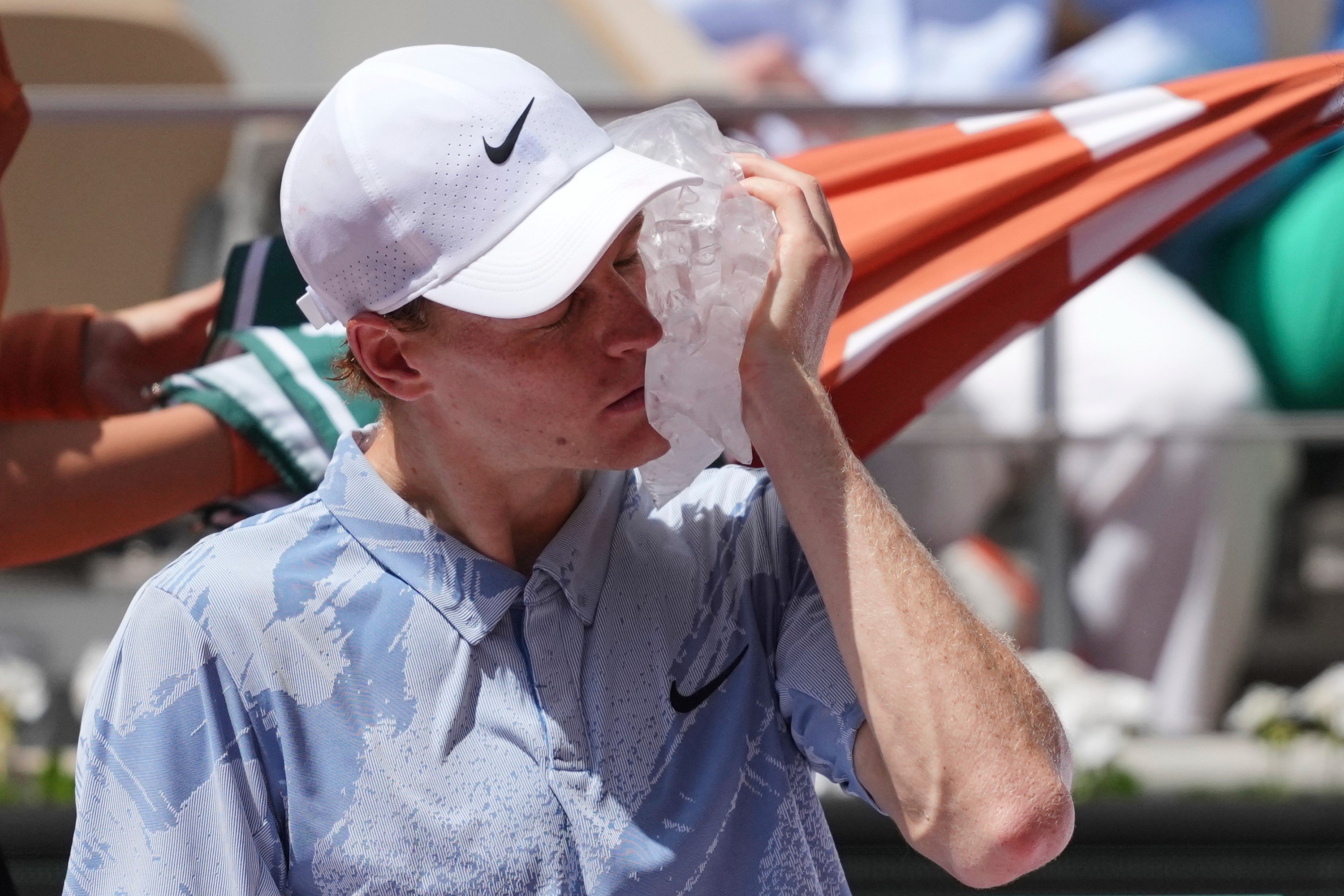Jannik Sinner of Italy cools himself with the ice during the second round men's singles tennis match against Juan Manuel Cerundolo of Argentina at the French Open tennis tournament in Paris, Thursday, May 28, 2026.