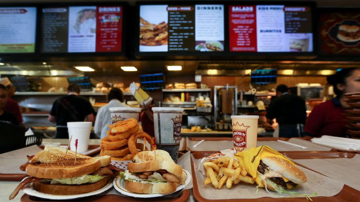 The Sandy location of Crown Burgers is closed indefinitely after an attic fire broke out above the kitchen and spread to the roof before being extinguished Thursday morning.