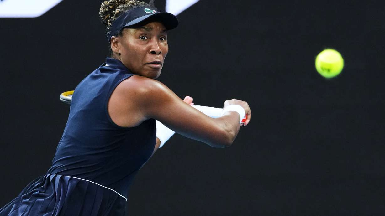 FILE - Venus Williams, of the United States, plays a backhand return to Olga Danilovic, of Serbia, during their first round match at the Australian Open tennis championship in Melbourne, Australia, Jan. 18, 2026.