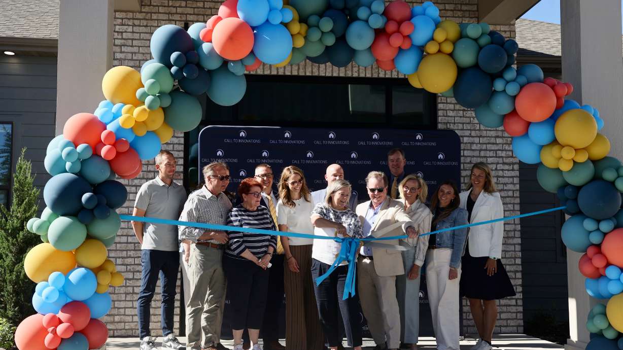 The ribbon is cut during the grand opening of Innovation Park at Holbrook Farms and the Lehi-Rippy Literacy Center in Lehi on Thursday.