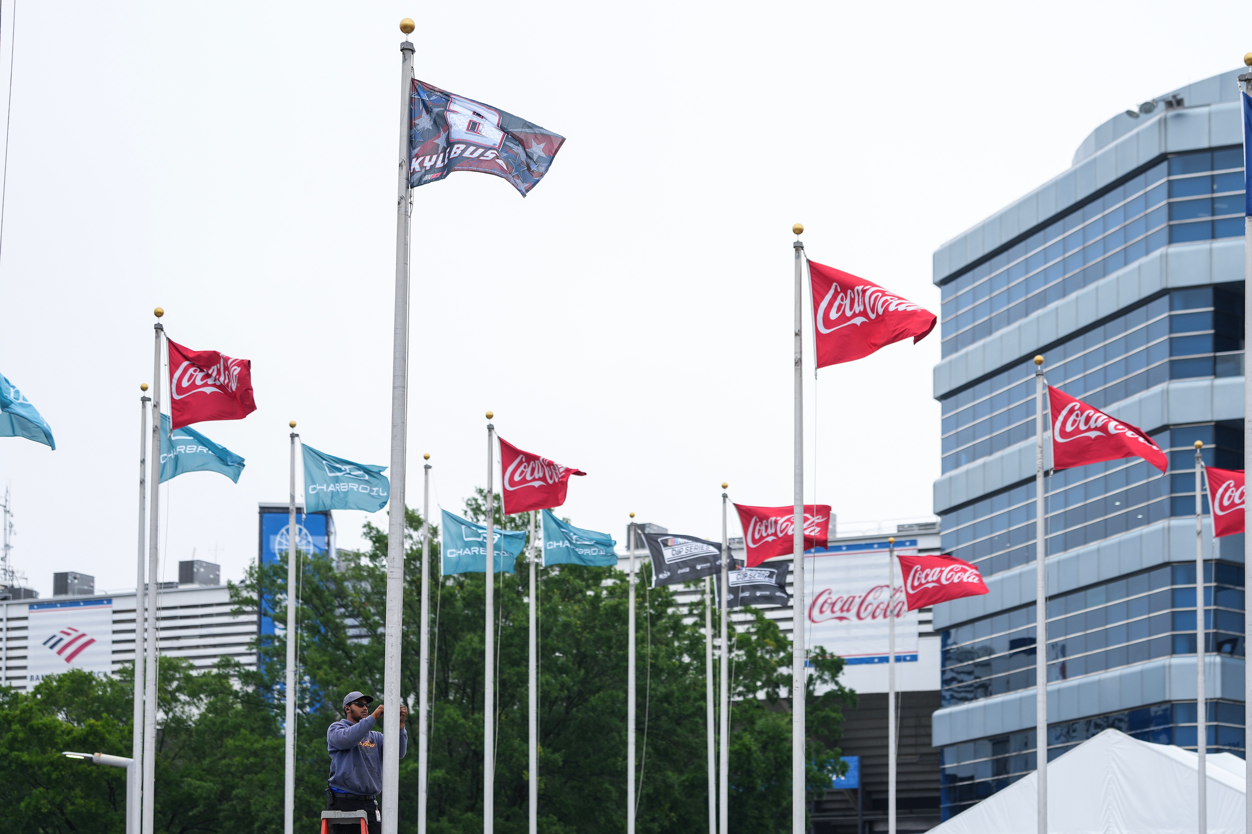 A flag is raised in honor of the late driver Kyle Busch outside of Charlotte Motor Speedway, Friday, May 22, 2026, in Charlotte, N.C. 