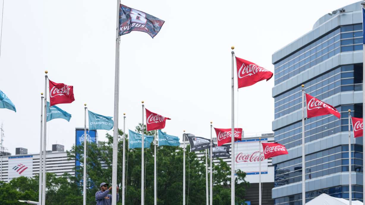 A flag is raised in honor of the late driver Kyle Busch outside of Charlotte Motor Speedway, Friday, May 22, 2026, in Charlotte, N.C.
