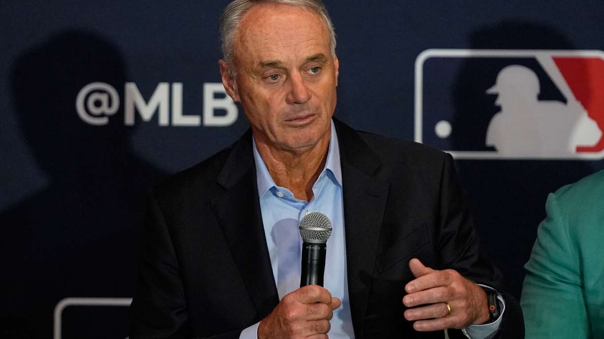 FILE - Rob Manfred, commissioner of Major League Baseball answers questions during a news conference at the MLB winter meetings, Dec. 8, 2025, in Orlando, Fla.