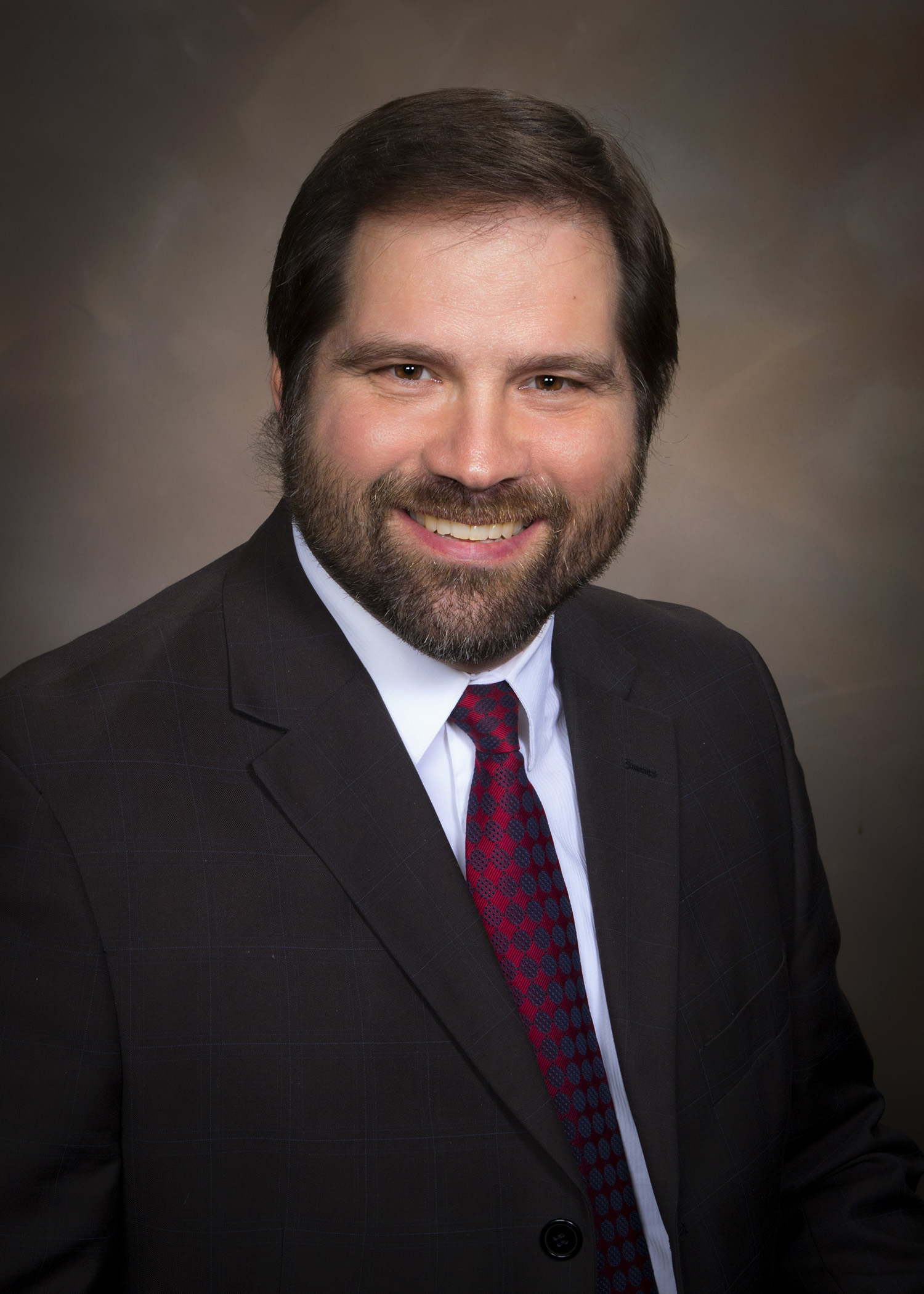 Weber County Clerk/Auditor Ricky Hatch is one of the targets of a lawsuit filed Wednesday by three Weber County Commission hopefuls trying to remove a fourth candidate from the ballot.