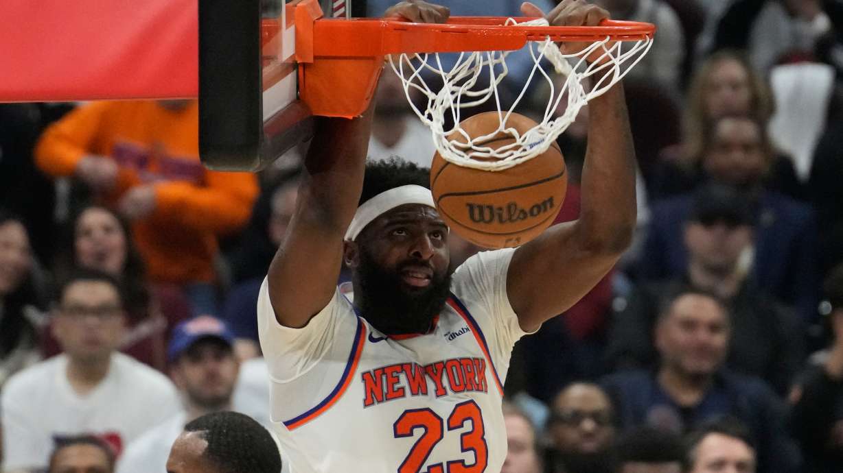 New York Knicks center Mitchell Robinson dunks during the second half of Game 4 in the Eastern Conference finals NBA basketball playoffs series against the Cleveland Cavaliers in Cleveland, Monday, May 25, 2026.