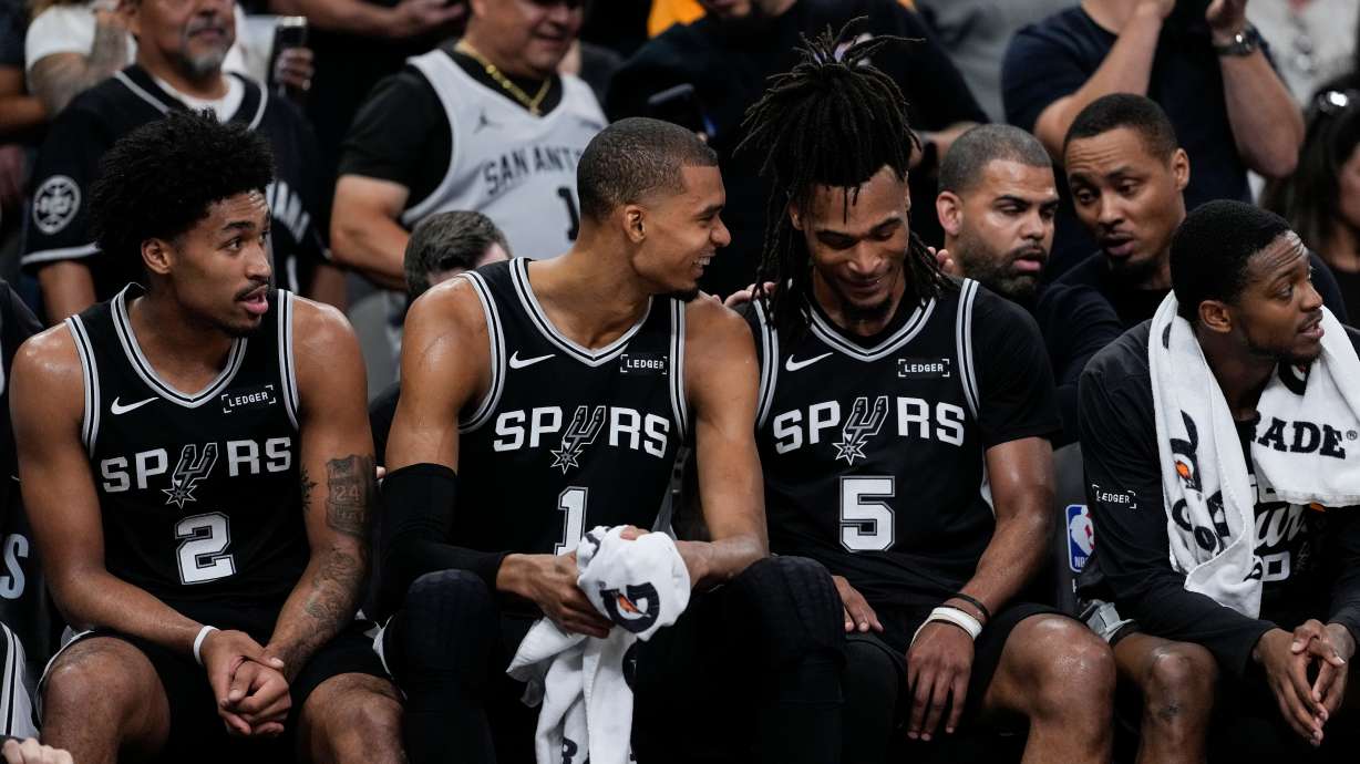 San Antonio Spurs' Victor Wembanyama (1) speaks with Stephon Castle (5) on the bench in the second half of Game 6 in the Western Conference finals NBA basketball playoffs series, Thursday, May 28, 2026, in San Antonio.
