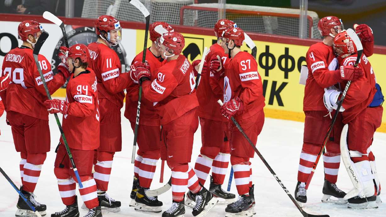FILE - Team of Russia players celebrate during the Ice Hockey World Championship group A match between the Russia and Czech Republic at the Olympic Sports Center in Riga, Latvia, May 21, 2021.